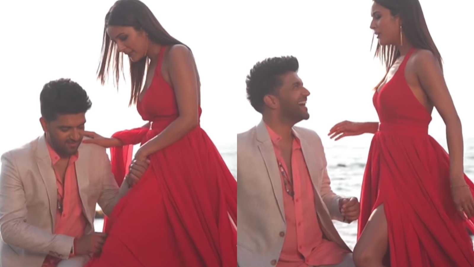 Guru Randhawa tries to cover up Shehnaaz Gill''s exposed leg as they pose together, she adorably bosses him around in new video; See