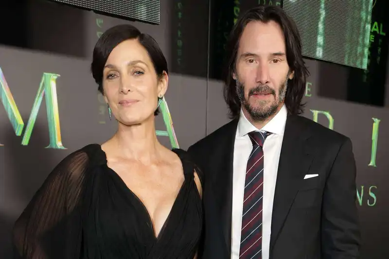 <p>Keanu and Carrie (Source: People Magazine)</p>