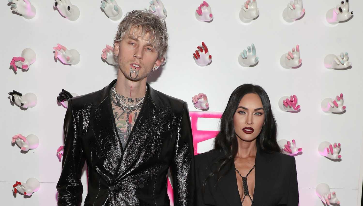 Megan Fox cheers on fiance Machine Gun Kelly as he plays during