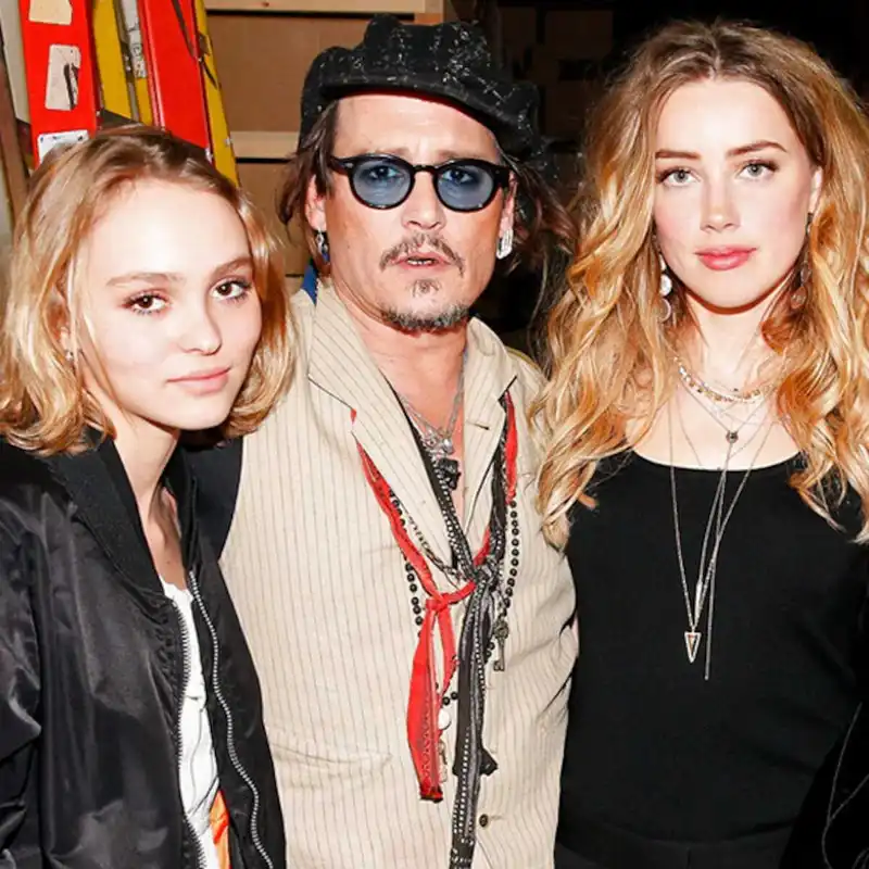 <p>Lily-Rose Depp, Johnny Depp, and Amber Heard (Source: E!Online)</p>