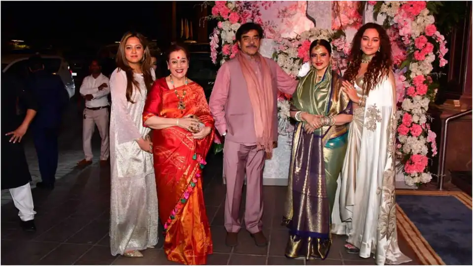 Sonakshi Sinha, Poonam Sinha, Shatrughan Sinha, and Rekha at a wedding reception