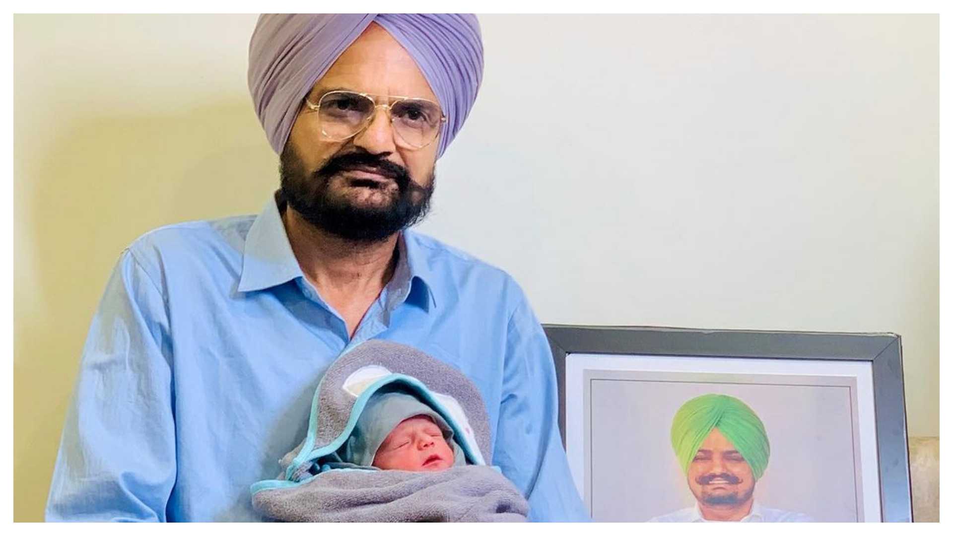 <p>Balkaur Singh with his son</p>