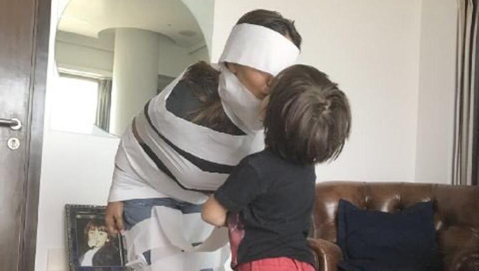 AbRam makes a literal, toilet paper mummy out of Gauri Khan. See pic