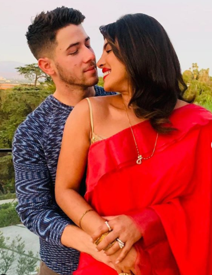 Priyanka Chopra Cuddles Up With Husband Nick Jonas On Karwa Chauth Looking Stunning In A Red Saree