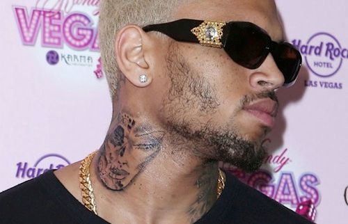 Chris Browns neck tattoo is not Rihannas bruised face?